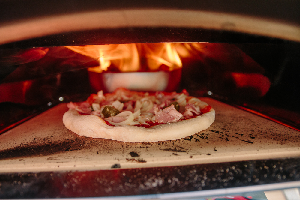 Ooni Karu Cooking Pizza with Wood